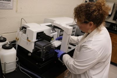 A student works in the NanoBio Lab
