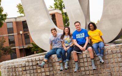 Socktober Students at W Statue