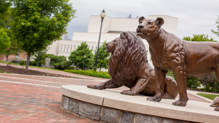 Pride lion statues on Widener's Chester campus.