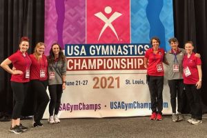 PT grad Rachel Sine poses with team members at the 2021 Olympic Trials