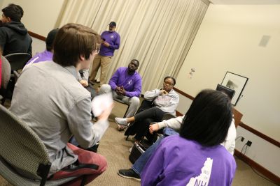 Students engage in discussion at a New Hampshire Primary watch party