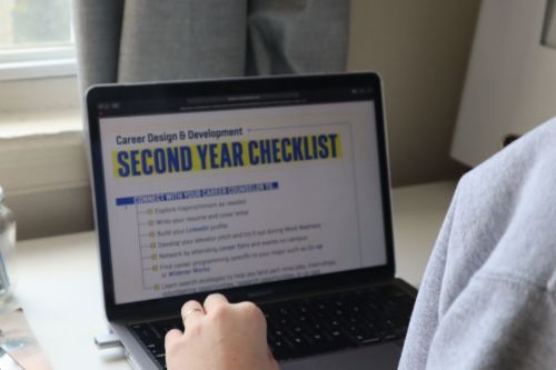 Laptop shows the Career Design and Development Checklist