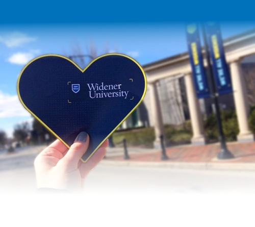 Thank you heart A hand holds up a heart with "Widener University" inscribed inside