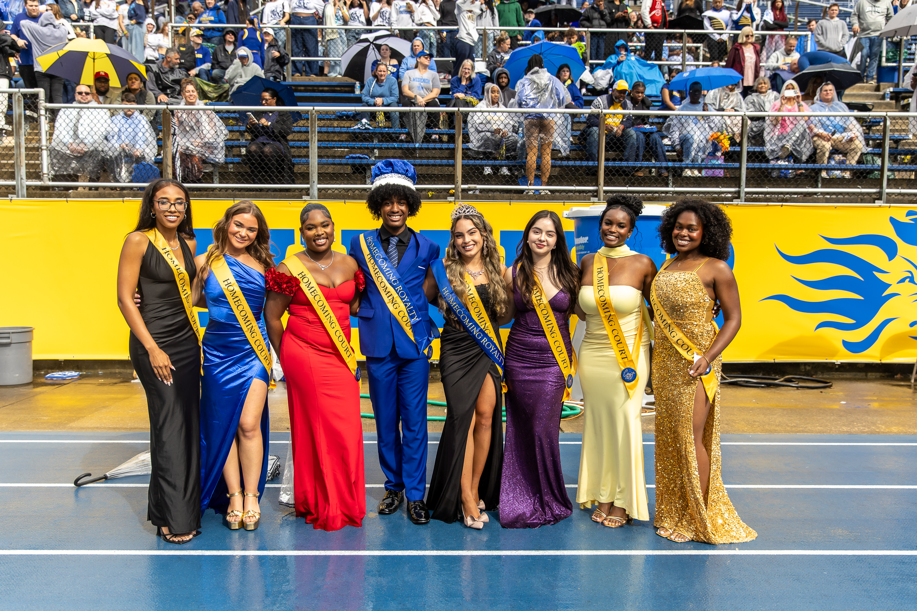 The Homecoming Court 2025 poses on the field.